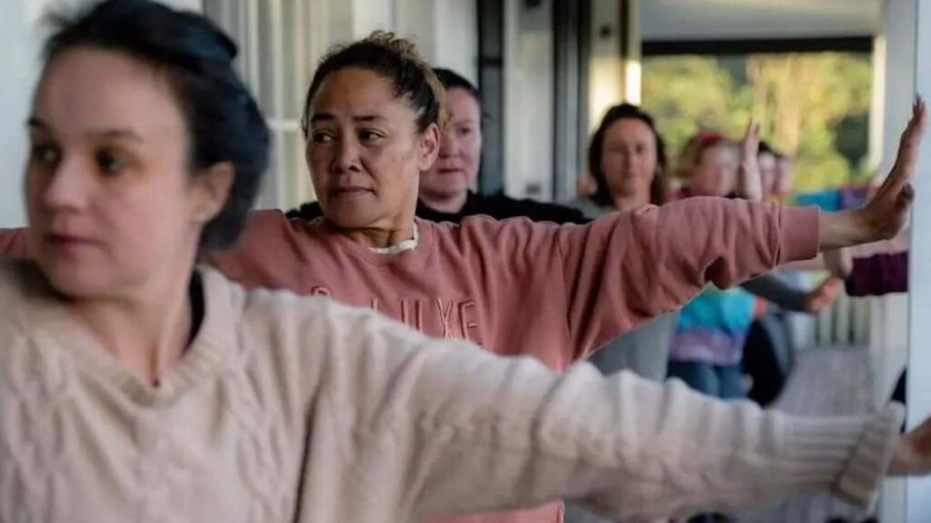 A group of women in yoga class