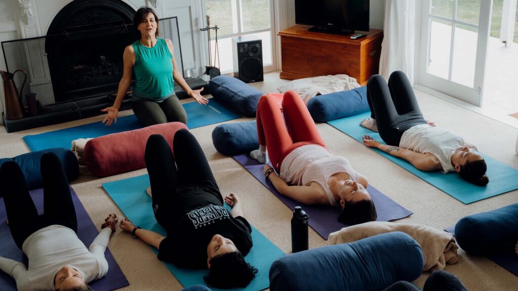 Group of women lying on the floor in meditation class