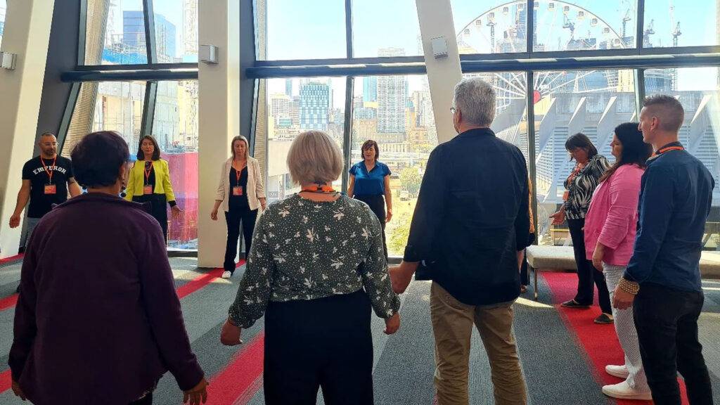 group of 10 people in yoga class